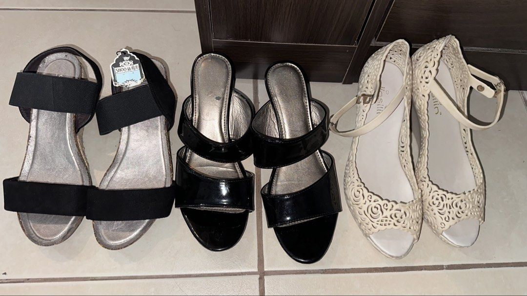 Take All❕Wedge Heels Sandals Bundle (Category: Wedges) located in Mandaluyong City. Submitted by TheWeekendProject (Listing ID 1460172257, Image 1). Description: - 3 pairs of stylish wedge footwear. - Pair 1: Classic black patent wedge heels. - Pair 2: Chic elastic black and silver wedge (unused with tag) - Pair 3: Stylish Beige sling back wedge (needs reglue) - Sandals are from assorted brands - Versatile for both casual outings and dressing up.