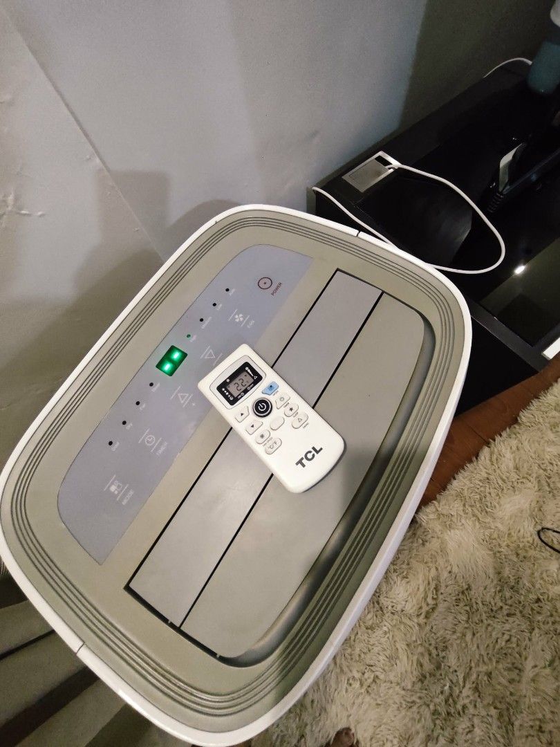 TCL 1.5 hp Portable Air Conditioner with Remote (Category: Air Conditioning and Heating) located in Quezon City. Submitted by lyn.22 (Listing ID 1460125737, Image 2). Description: - TCL 1.5 HP Portable Air Conditioner (Model: TAC-12CPA/W) - Powerful Cooling: 12600 kJ/h capacity - High Airflow: 350 m³/h - Quiet Operation: Only 54 dB(A) noise level - Includes: Remote control and exhaust hose - Easy to Move: Net weight of 29 kg TCL 1.5hp Portable AC