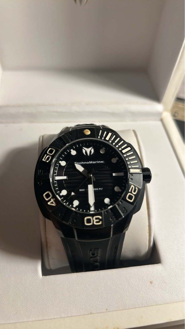 TechnoMarine Dive Watch 500M (Category: Men's Watches) located in Paranaque City. Submitted by declutterby4angels (Listing ID 1460296075, Image 1). Description: - Brand: TechnoMarine - Color: Black - Type: Dive Watch - Water Resistance: Up to 500 meters (1650 ft) - Dial: Black with white markers and hands - Bezel: Rotating, black - Includes: Original box - Ideal for: Diving and everyday wear -Negotiable.