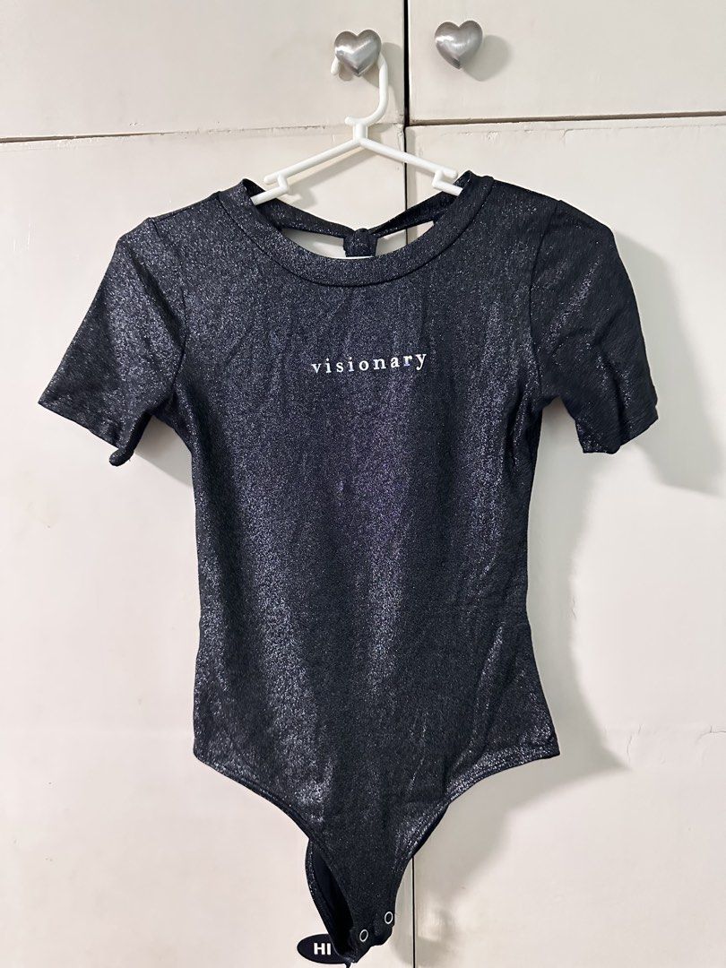 Terranara Black Sparkly Bodysuit XS (Category: Others Tops) located in Quezon City. Submitted by bentabelles (Listing ID 1460257844, Image 1). Description: - Black sparkly bodysuit from Terranara - Short sleeves with tie-back neck detail - Features 'visionary' print on the front - Versatile for layering or wearing alone - Size XS.