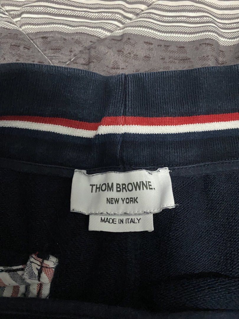 Thom Browne Navy Sweat Shorts Size 2 (Category: Shorts) located in Cavite. Submitted by JandyLou (Listing ID 1460132638, Image 3). Description: Carousell Listings Title: Navy blue Thom Browne sweat shorts Size: Size 2 - Made in Italy - Signature four-bar stripe detail on left leg - Elastic waistband with drawstring Condition: Like New (Color may vary due to lighting) Price: Php Flaws: No Flaws Payment Methods: Payment first via Gcash Delivery Opt