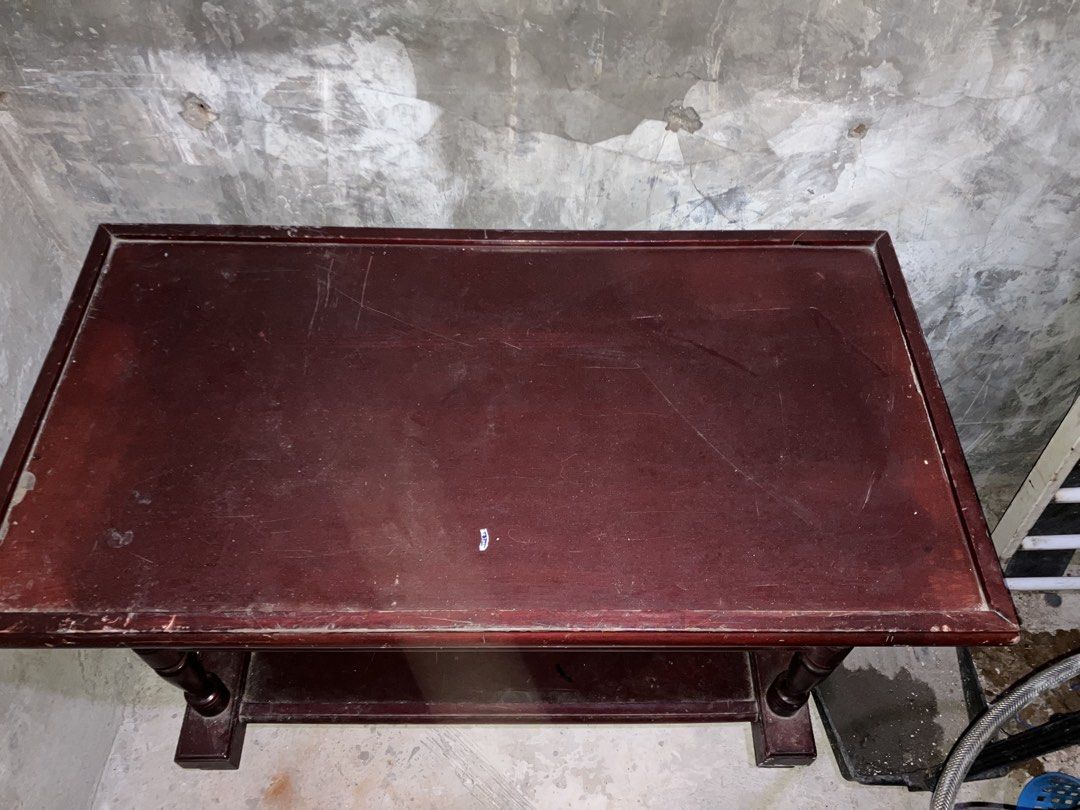 Three - tier Mahogany Side Table (Category: Tables & Sets) located in Quezon City. Submitted by ponpin (Listing ID 1460209675, Image 2). Description: - Dark red wood side table - Two lower shelves for storage/display - Turned wood legs - Top surface has visible scratches - Functional piece for any room - Requires cleaning Negotiable price PM for INFO - Sold as is.