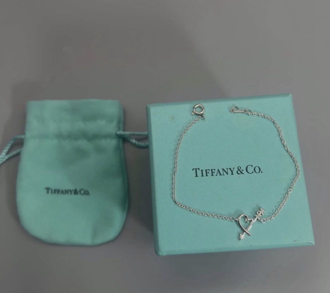 Tiffany & Co. Sterling Silver Necklaces (Category: Necklaces) located in Santo Tomas. Submitted by mrsd17 (Listing ID 1460209427, Image 3). Description: Authentic Tiffany & Co. necklace. Features a cute sterling silver dog charm. Comes with the original Tiffany & Co. box and pouch. Chain is delicate and silver. Great piece for any dog lover..