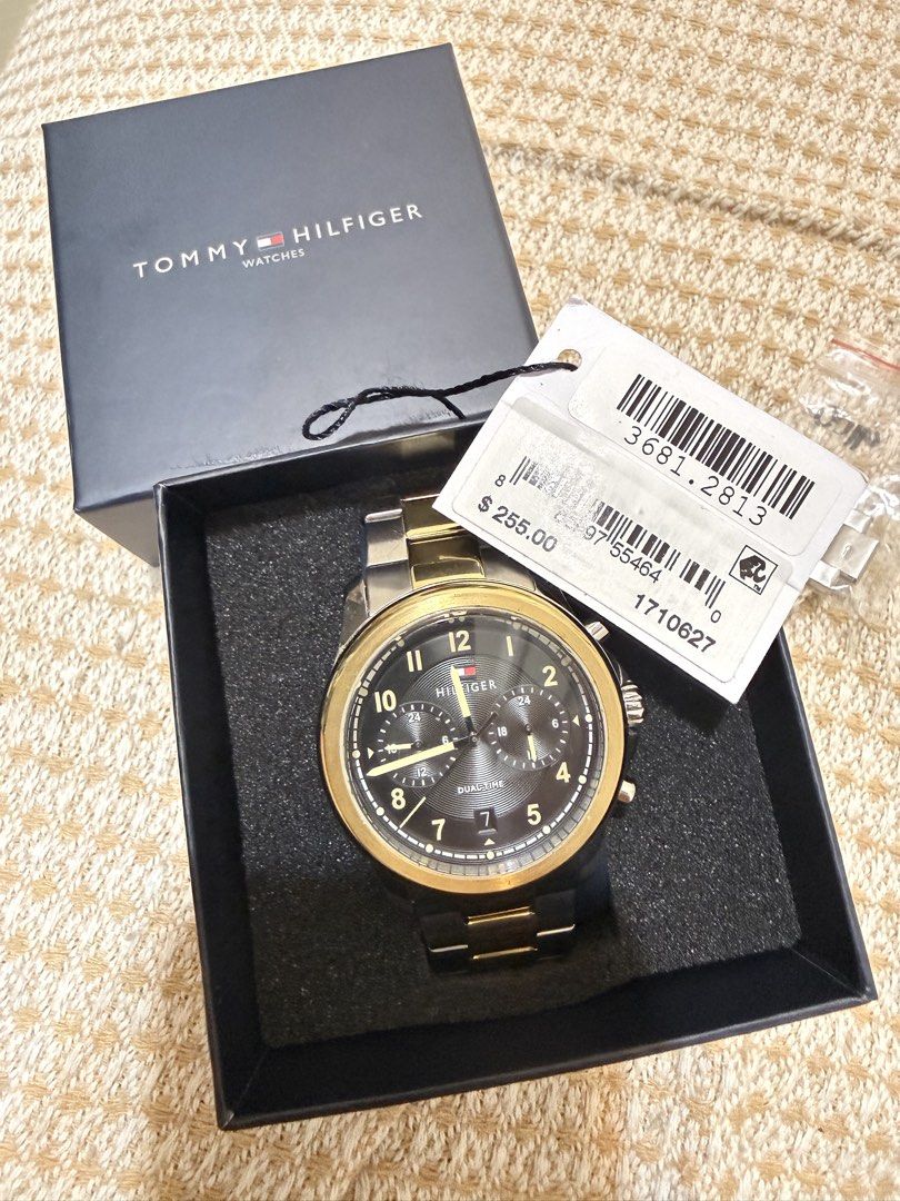 Tommy Hilfiger Dual Time Watch (Category: Men's Watches) located in Mandaluyong City. Submitted by bryllepogi (Listing ID 1460281783, Image 1). Description: - Authentic Tommy Hilfiger Dual-Time Watch - Elegant Black and Gold Face - Brand New, Never Worn - Original Box and Tags Included - Price Tag Still Attached - Ideal for Everyday Wear - Excellent Gift Option.