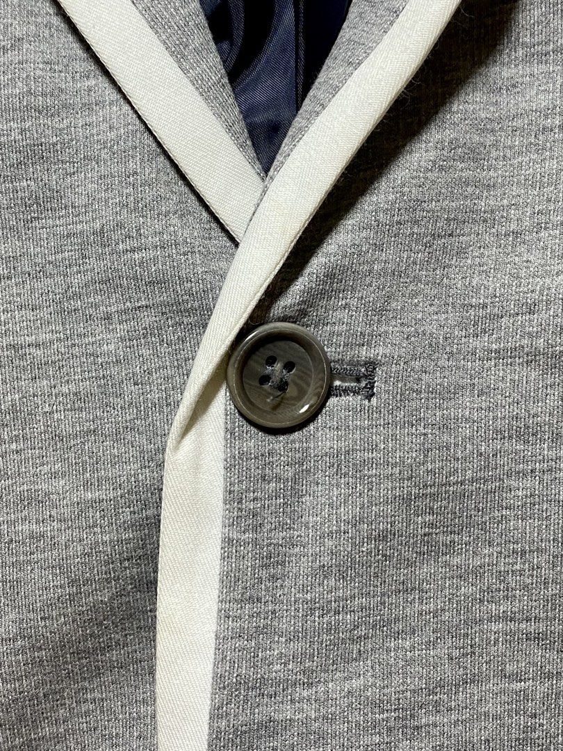 Topman Grey Blazer with White Trim (Category: Coats, Jackets and Outerwear) located in Manila. Submitted by sebthrift (Listing ID 1460128985, Image 2). Description: - Topman Grey Blazer - White trim detail on lapels and pockets - Navy blue inner lining - Two-button front closure - Four-button cuffs - Made in Turkey - Size: UK 40 / EUR 40 / CM 101 / US 40.