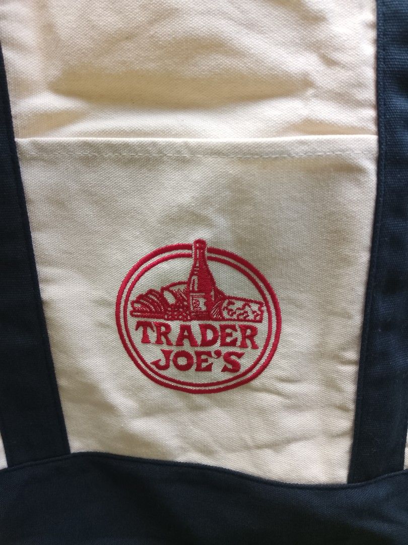Trader Joe's Tote Bag (Large Size) (Category: Tote Bags) located in San Miguel. Submitted by skirt_girlph (Listing ID 1460231390, Image 2). Description: Brand new Trader Joe's Classic Reusable Tote Bag Factory pull-out Imported from Vietnam Size: 54 cm. x 37 cm. x 29 cm. Color: Navy blue/cream With original inside tag (see last photos) 10 pcs. available Fix Price Please note a production tolerance of 1-2 cm. may apply. Actual color may vary from 