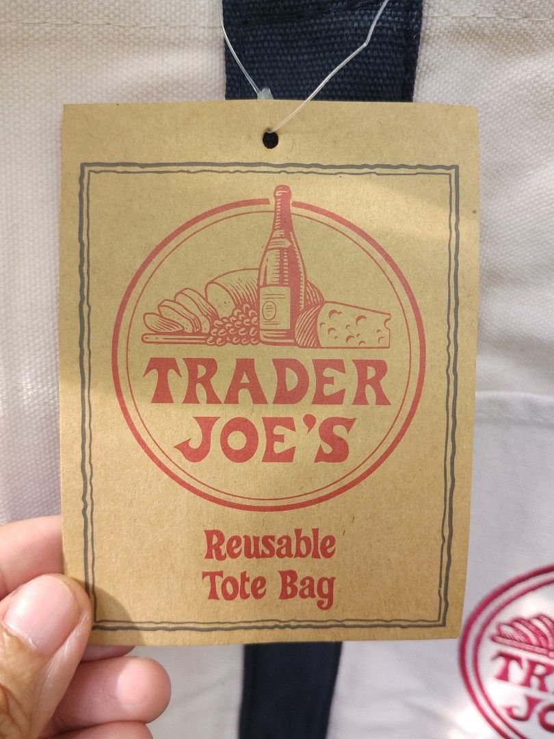 Trader Joe's Tote Bag (Large Size) (Category: Tote Bags) located in San Miguel. Submitted by skirt_girlph (Listing ID 1460231390, Image 3). Description: Brand new Trader Joe's Classic Reusable Tote Bag Factory pull-out Imported from Vietnam Size: 54 cm. x 37 cm. x 29 cm. Color: Navy blue/cream With original inside tag (see last photos) 10 pcs. available Fix Price Please note a production tolerance of 1-2 cm. may apply. Actual color may vary from 