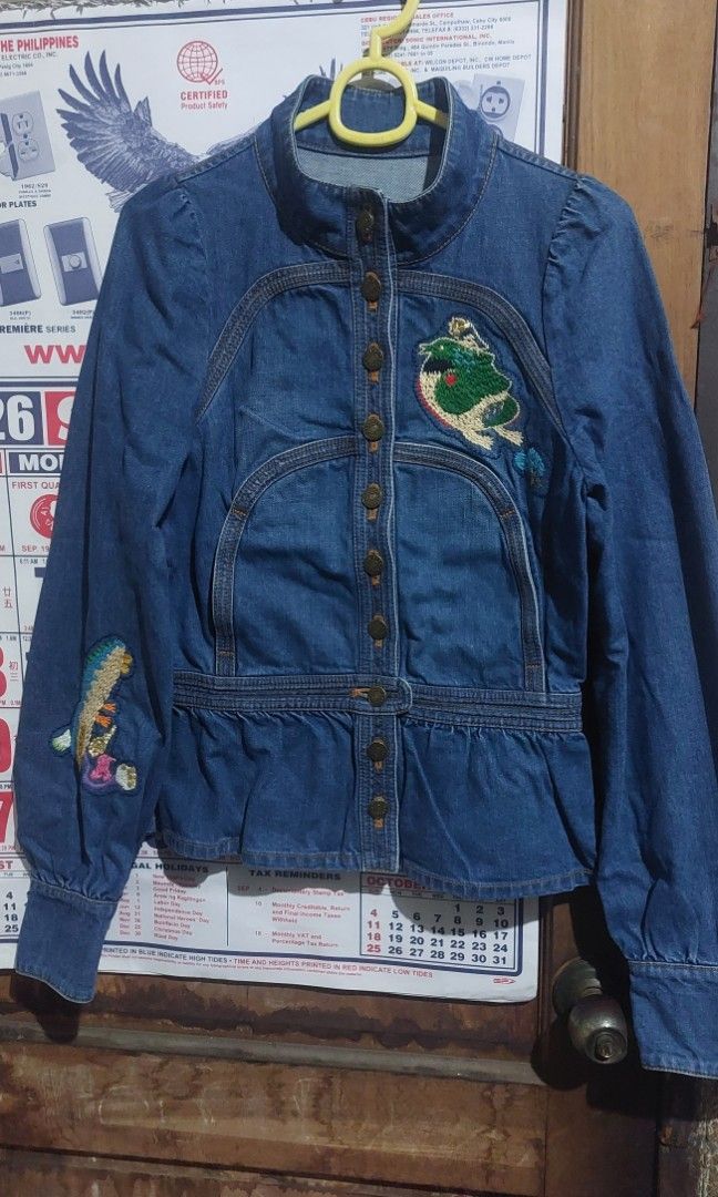 Tsumori Chisato Denim Jacket Rare (Category: Luxury Apparel) located in Manila. Submitted by myelite.otakuworld (Listing ID 1460275735, Image 1). Description: Own a piece of designer history from Issey Miyake former designer Tsumori Chisato Special cspsule archival piece. Indigo dyed, Made in Japan Unique embroidered details on selvedge denim Size 2 Women Tsumori Chisato buttons With handwarmers integrated in the design.