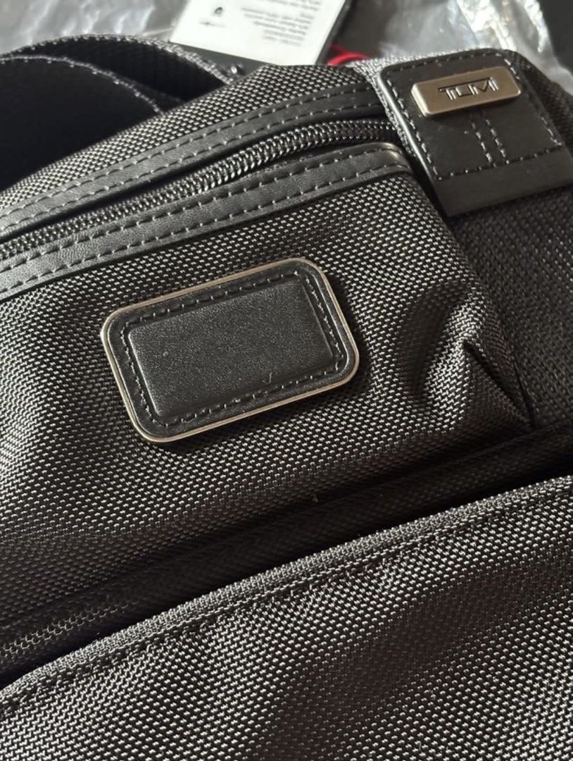 Tumi Kerby Crossbody Bag (Category: Cross-body Bags) located in Manila. Submitted by taruerin (Listing ID 1460159511, Image 2). Description: Black Tumi crossbody bag - Multiple zippered compartments - Adjustable shoulder strap - with tag and paper bag - bought from US.