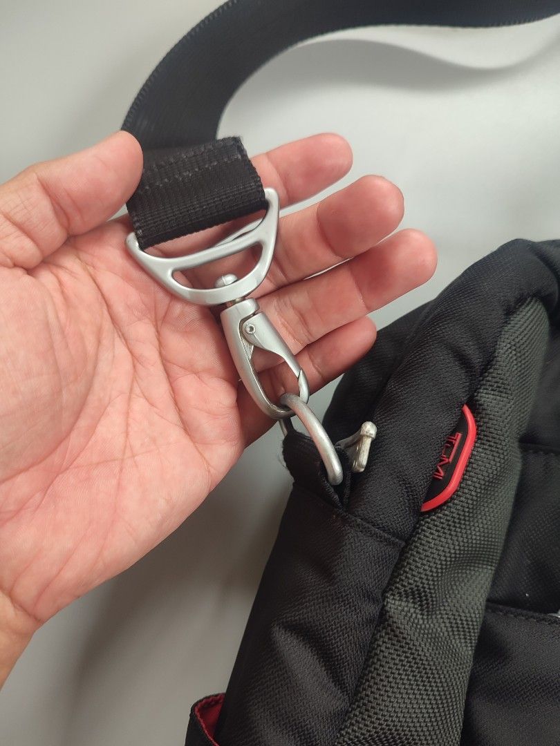 TUMI Laptop bag (Category: Laptop Bags & Sleeves) located in Lipa City. Submitted by gudoys_outdoor16 (Listing ID 1460255931, Image 3). Description: - Tumi Laptop Bag - Main compartment for your laptop and essentials - Front zippered pocket for quick access items - Additional smaller front pocket with internal organizers - Detachable and adjustable shoulder strap for comfortable carrying - Dual handles for a classic briefcase-style carry - Ideal 