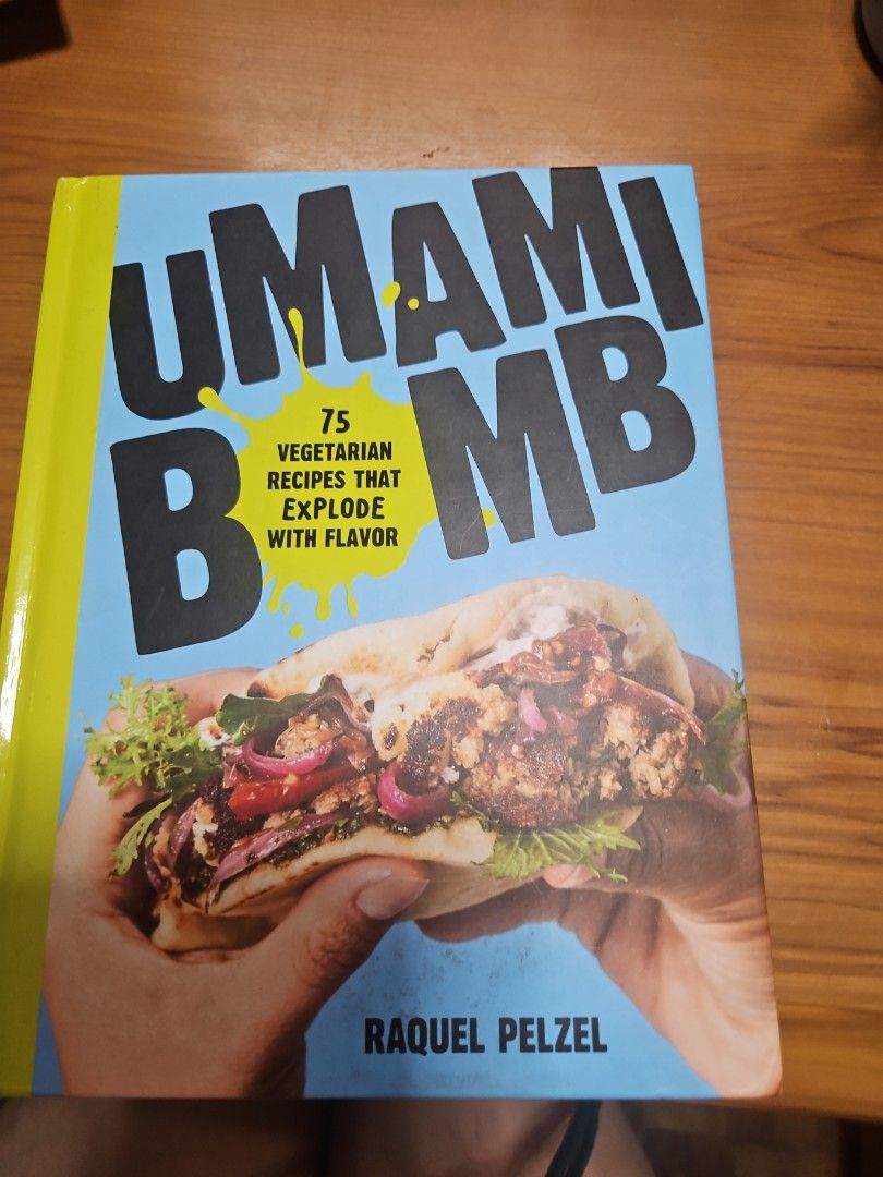 Umami Bomb: 75 Vegetarian Recipes That Explode With Flavor (Category: Storybooks) located in Manila. Submitted by hausofgadgetatbp (Listing ID 1460179359, Image 1). Description: - Umami Bomb Cookbook by Raquel Pelzel - Features 75 vegetarian recipes - Designed to be full of flavor - Highlights 'Pure Vegetable Magic!' - Includes recipes like caramelized onions and double chocolate cake - Great for spicing up vegetarian cooking.