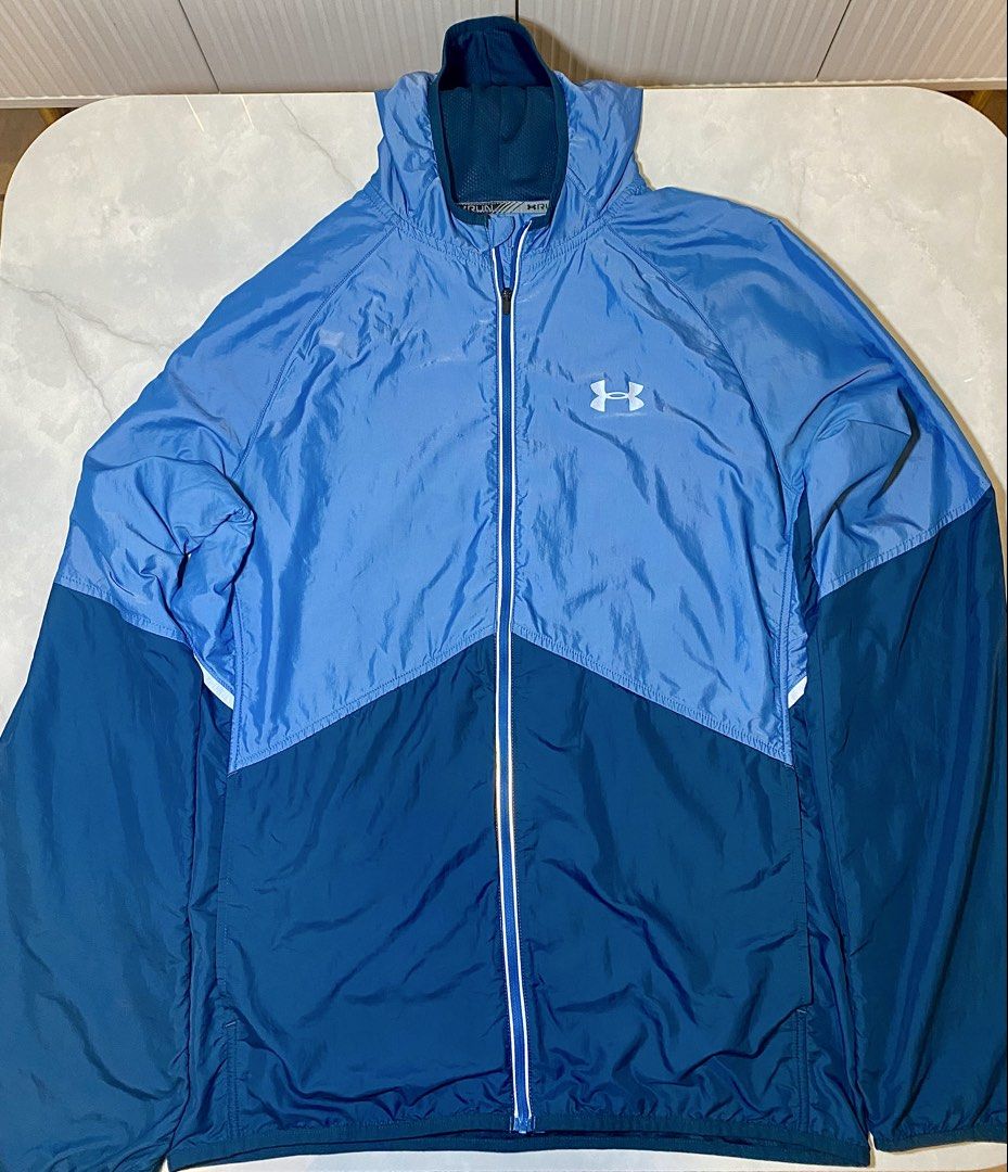 Under Armour Men's Fitted Running Jacket MD/M (Category: Coats, Jackets and Outerwear) located in Manila. Submitted by sebthrift (Listing ID 1460128240, Image 1). Description: - Under Armour Running Jacket - Color: Blue and Navy Color Block - Material: Lightweight and Breathable - Features: Full Zip Closure - Size: Medium - Ideal for: Workouts or Casual Wear.