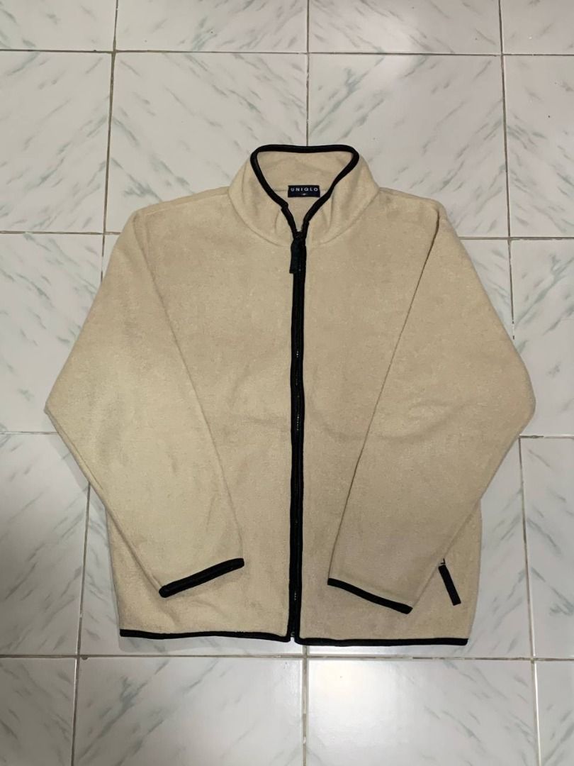 Uniqlo Beige Fleece Zip-Up Jacket (Category: Coats, Jackets and Outerwear) located in Marikina City. Submitted by cosmicfish_aad03c (Listing ID 1460148323, Image 1). Description: Uniqlo light beige fleece jacket with black zip and trim. Two side pockets. Perfect for layering and staying warm. L - 24.5 W - 18.