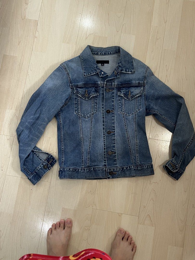 UNIQLO Denim Jacket Size S (Category: Coats, Jackets and Outerwear) located in Manila. Submitted by dragonlady118 (Listing ID 1460113050, Image 1). Description: - Classic blue denim jacket from UNIQLO - Size: S - Button-up front - Two chest pockets - Comfortable cotton and spandex blend - Ideal for layering - Versatile for any outfit.