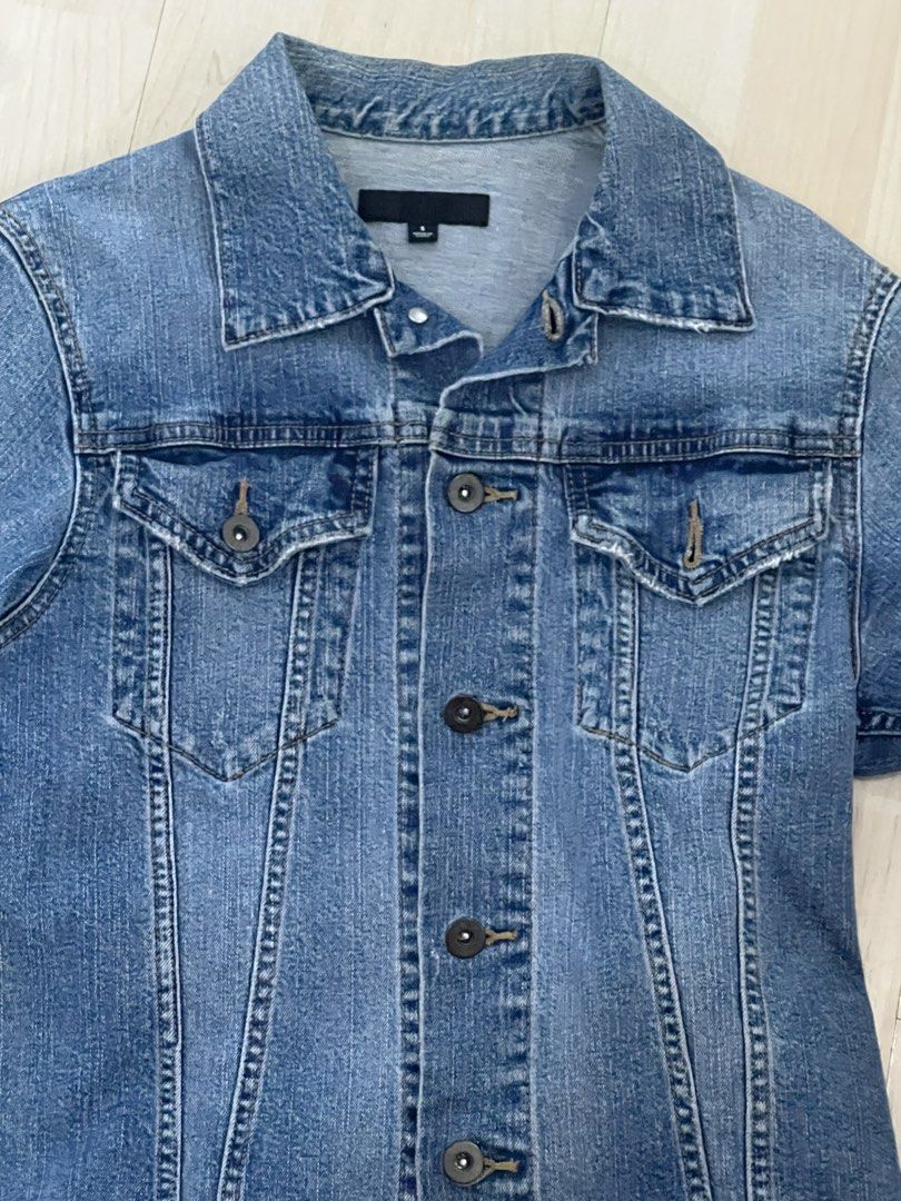 UNIQLO Denim Jacket Size S (Category: Coats, Jackets and Outerwear) located in Manila. Submitted by dragonlady118 (Listing ID 1460113050, Image 2). Description: - Classic blue denim jacket from UNIQLO - Size: S - Button-up front - Two chest pockets - Comfortable cotton and spandex blend - Ideal for layering - Versatile for any outfit.