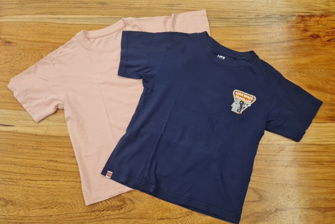 Uniqlo Kids T-shirts Bundle (2 pcs) (Category: Babies & Kids Fashion) located in Cavite. Submitted by helpusdeclutter (Listing ID 1460222280, Image 2). Description: Uniqlo Kids T-Shirts Store bought. In great condition Size 130. Can fit 6-8 years old Set of 2: - Includes: 1 plain pink tee - Includes: 1 navy blue tee with Lego Space Exploration graphic on back and Lego Space Traveller print on front Ideal for Lego fans Selling for P300 only..