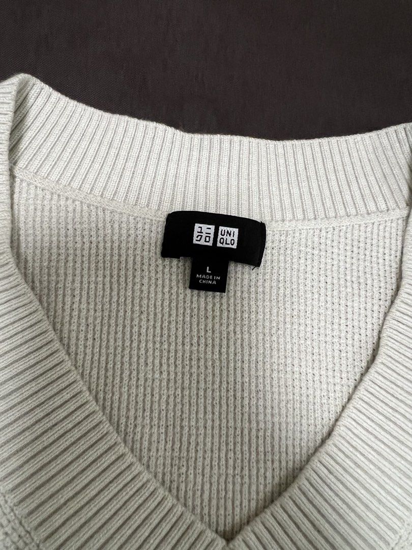 Uniqlo knitted v-neck (Category: Tshirts & Polo Shirts ) located in Mandaluyong City. Submitted by minimalmeowguy (Listing ID 1460117296, Image 2). Description: Uniqlo v neck - knit blend fabric - dimes are in the photos - 9/10 condition. Used but not abused - not my style anymore .