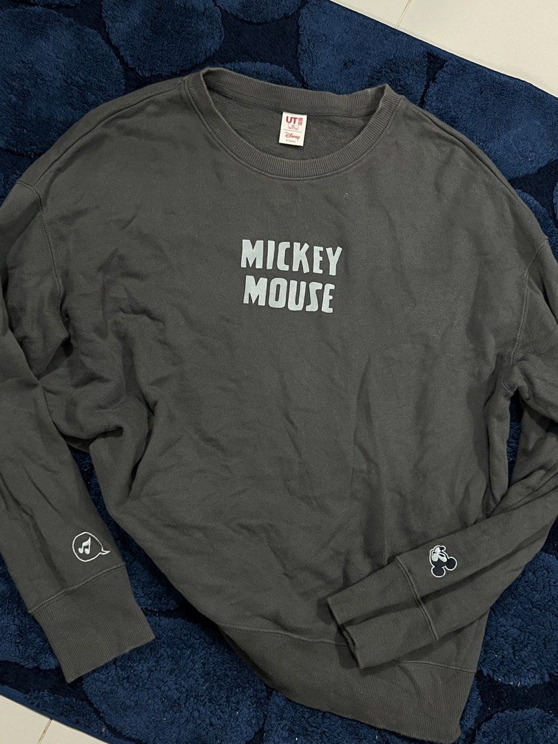Uniqlo Mickey Mouse Graphic Sweatshirt (Category: Longsleeves) located in Manila. Submitted by camieday04 (Listing ID 1460150220, Image 1). Description: - Grey Uniqlo sweatshirt - Features a prominent Mickey Mouse graphic print on the front - Subtle Mickey Mouse details on the sleeves - Comfortable and casual design - Ideal for everyday wear - Versatile: pairs well with jeans or shorts.