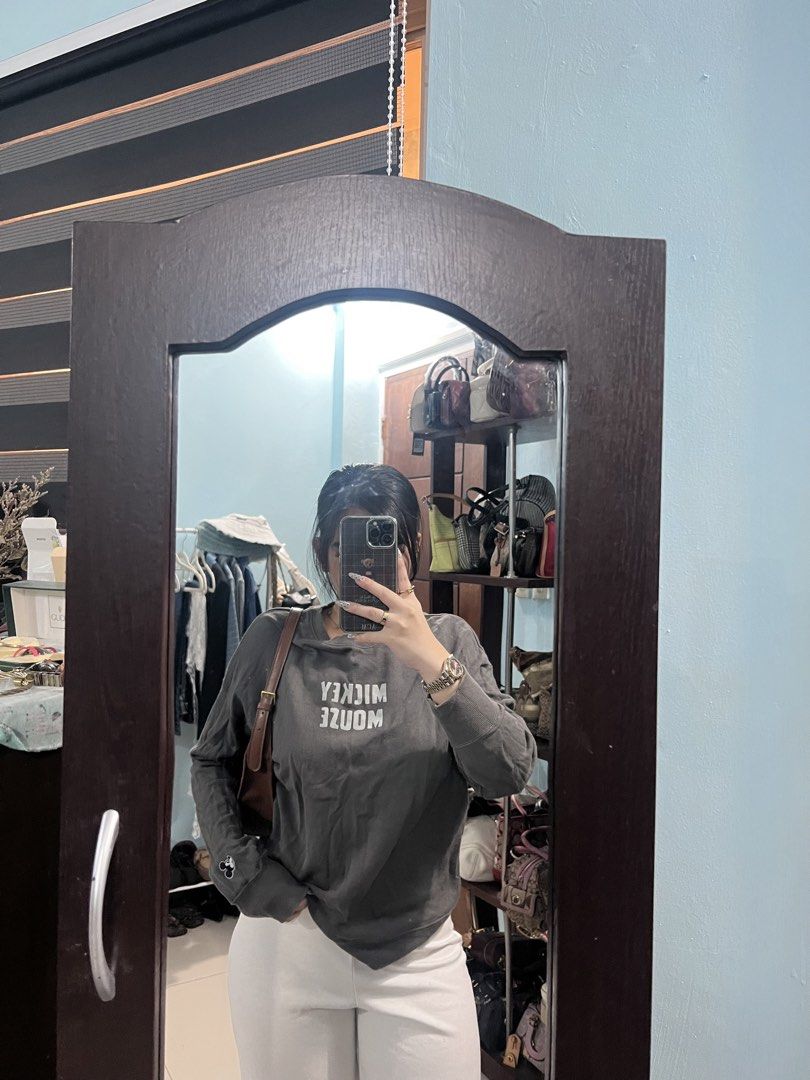 Uniqlo Mickey Mouse Graphic Sweatshirt (Category: Longsleeves) located in Manila. Submitted by camieday04 (Listing ID 1460150220, Image 2). Description: - Grey Uniqlo sweatshirt - Features a prominent Mickey Mouse graphic print on the front - Subtle Mickey Mouse details on the sleeves - Comfortable and casual design - Ideal for everyday wear - Versatile: pairs well with jeans or shorts.