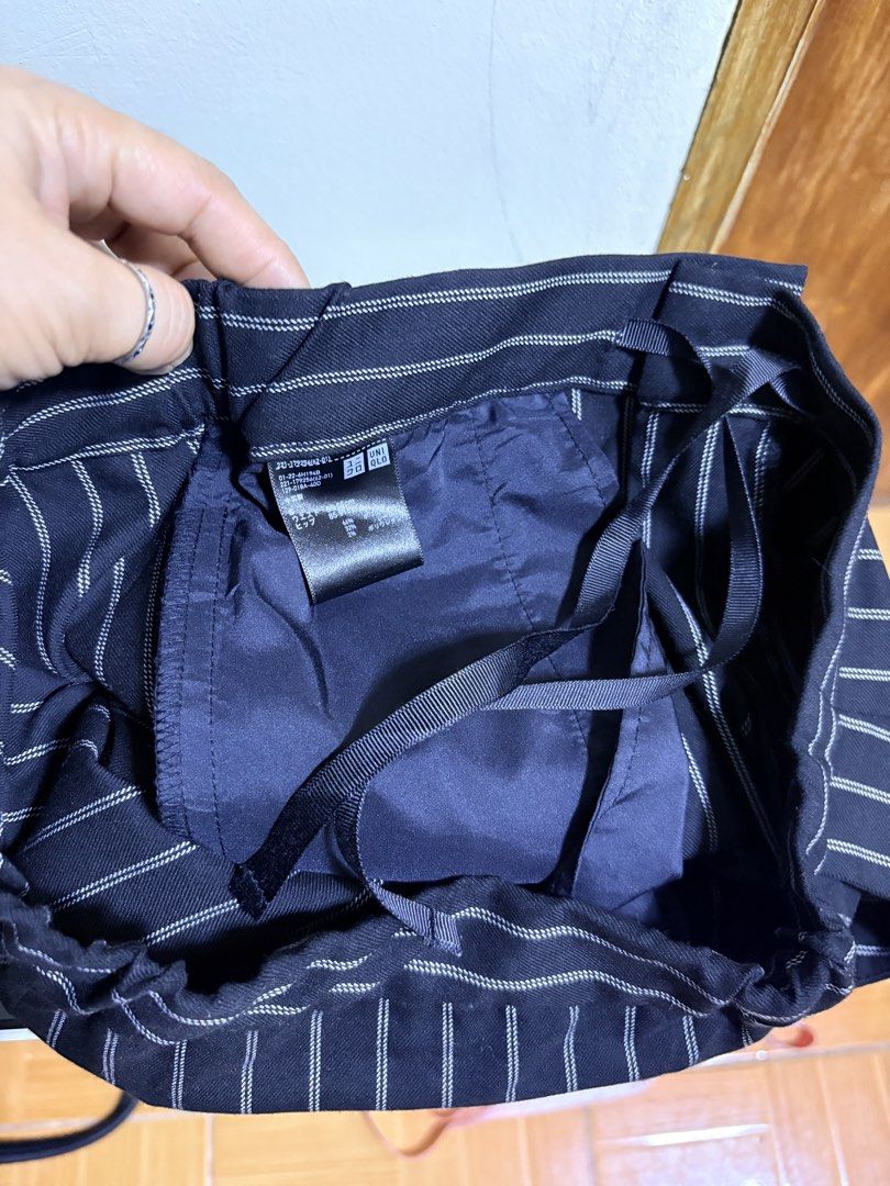 Uniqlo Striped Cropped Pants (Category: Other Bottoms) located in Paete. Submitted by skydruemadison (Listing ID 1460255146, Image 3). Description: - Black pants with white pinstripes - Cropped length - Drawstring waist with elastic waistband for comfort - Front and back pockets - Versatile for casual and smart-casual outfits - Easy to pair with various tops 26-30 L-36.5.