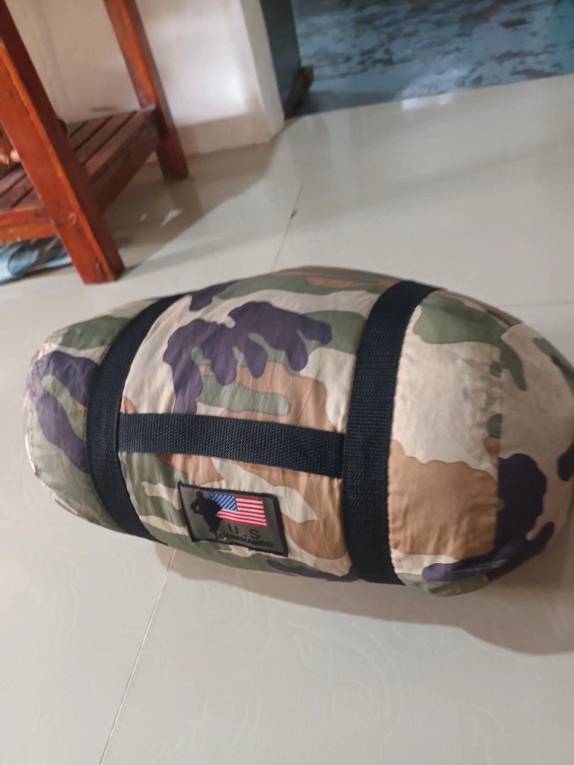 US Military Style Camouflage Sleeping Bag (Category: Hiking & Camping) located in Irosin. Submitted by whanchore55263 (Listing ID 1460129806, Image 1). Description: - Mummy style sleeping bag - Green interior - Woodland camouflage exterior pattern - Comes with straps for easy rolling and storage - Ideal for camping, hiking, and all outdoor adventures - Ready for your next trip!.