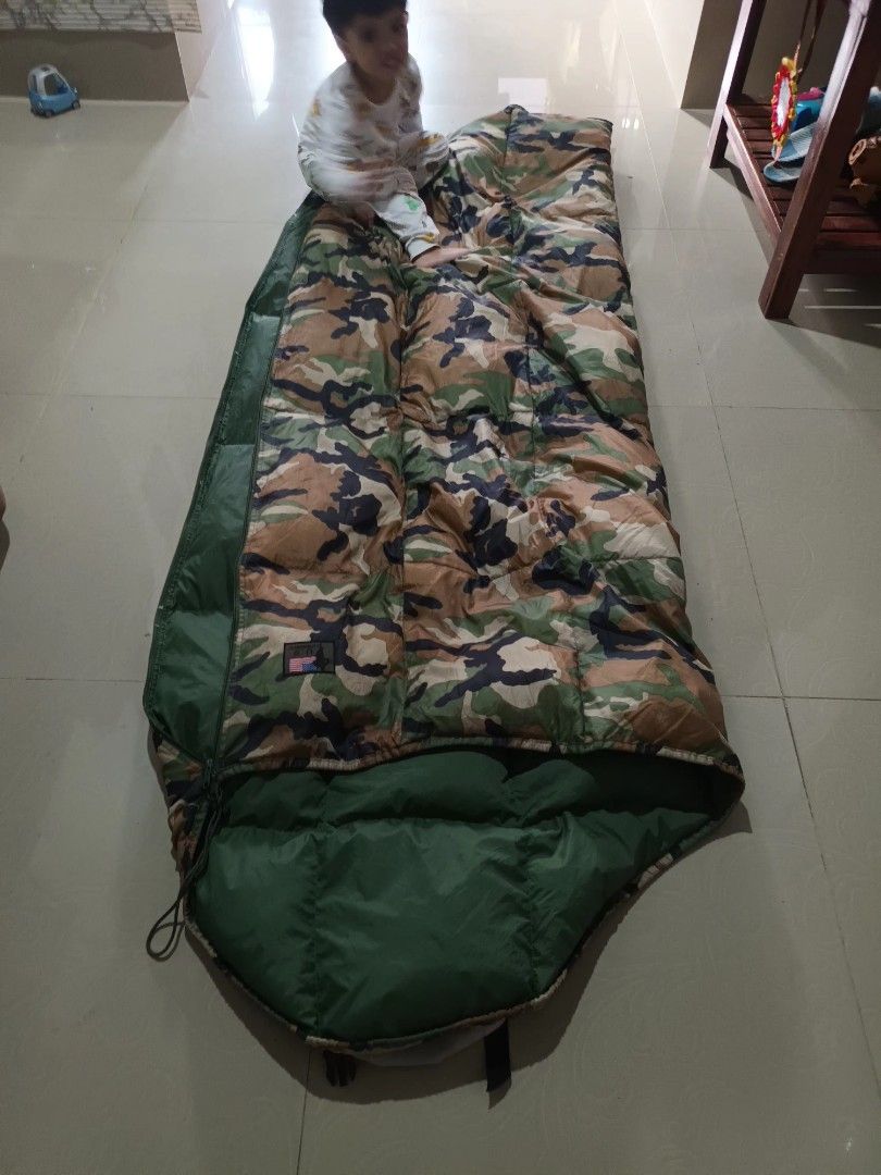 US Military Style Camouflage Sleeping Bag (Category: Hiking & Camping) located in Irosin. Submitted by whanchore55263 (Listing ID 1460129806, Image 2). Description: - Mummy style sleeping bag - Green interior - Woodland camouflage exterior pattern - Comes with straps for easy rolling and storage - Ideal for camping, hiking, and all outdoor adventures - Ready for your next trip!.
