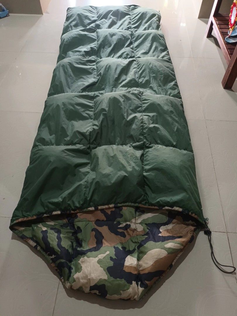 US Military Style Camouflage Sleeping Bag (Category: Hiking & Camping) located in Irosin. Submitted by whanchore55263 (Listing ID 1460129806, Image 3). Description: - Mummy style sleeping bag - Green interior - Woodland camouflage exterior pattern - Comes with straps for easy rolling and storage - Ideal for camping, hiking, and all outdoor adventures - Ready for your next trip!.
