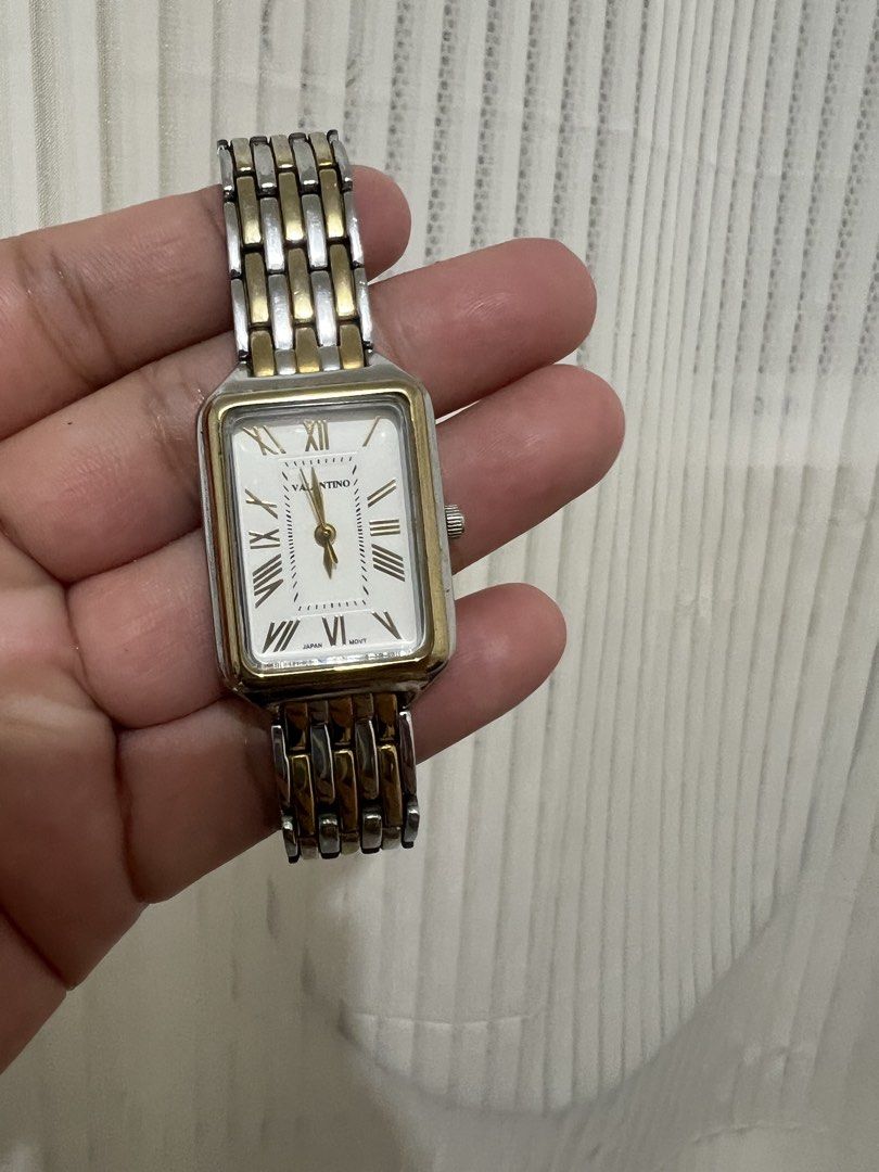 Valentino Rectangular Watch Two-Tone Stainless Steel (Category: Women's Watches) located in Cabanatuan. Submitted by didicstll (Listing ID 1460109012, Image 2). Description: - Brand: Valentino - Face Shape: Rectangular - Band Material: Two-tone stainless steel (silver & gold) - Dial Features: Roman numerals - Movement: Japan movement - Style: Classic, versatile for everyday or formal wear.