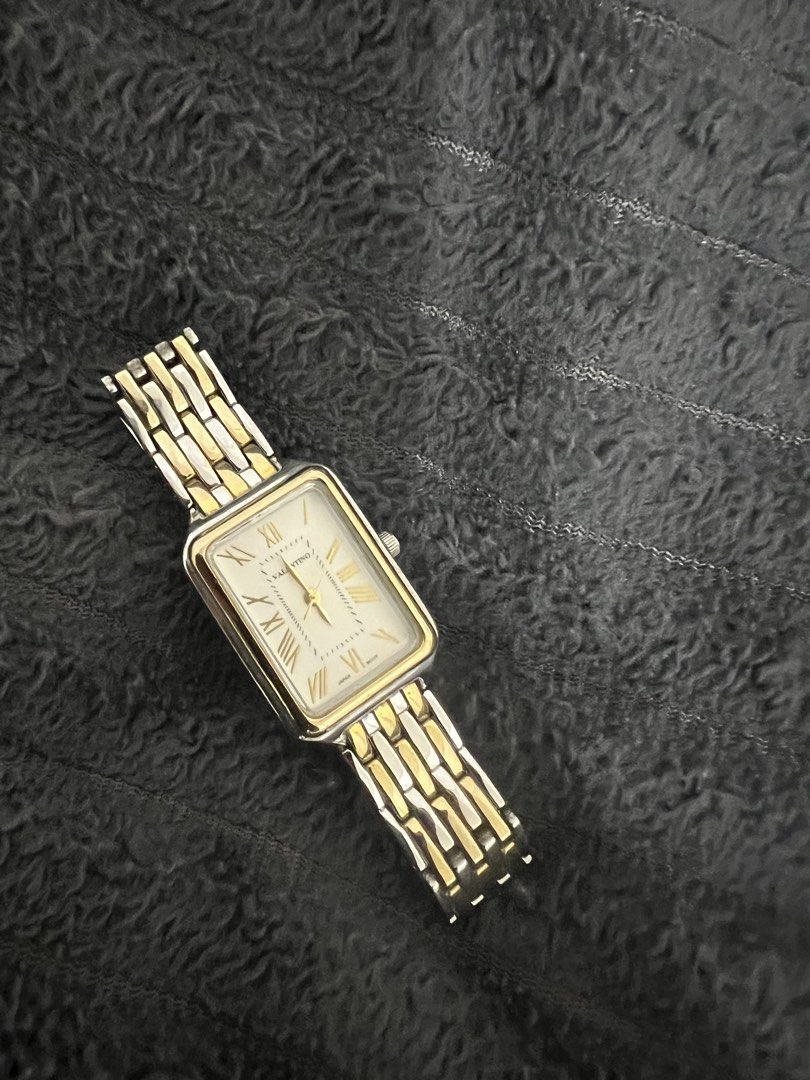 Valentino Rectangular Watch Two-Tone Stainless Steel (Category: Women's Watches) located in Cabanatuan. Submitted by didicstll (Listing ID 1460109012, Image 3). Description: - Brand: Valentino - Face Shape: Rectangular - Band Material: Two-tone stainless steel (silver & gold) - Dial Features: Roman numerals - Movement: Japan movement - Style: Classic, versatile for everyday or formal wear.