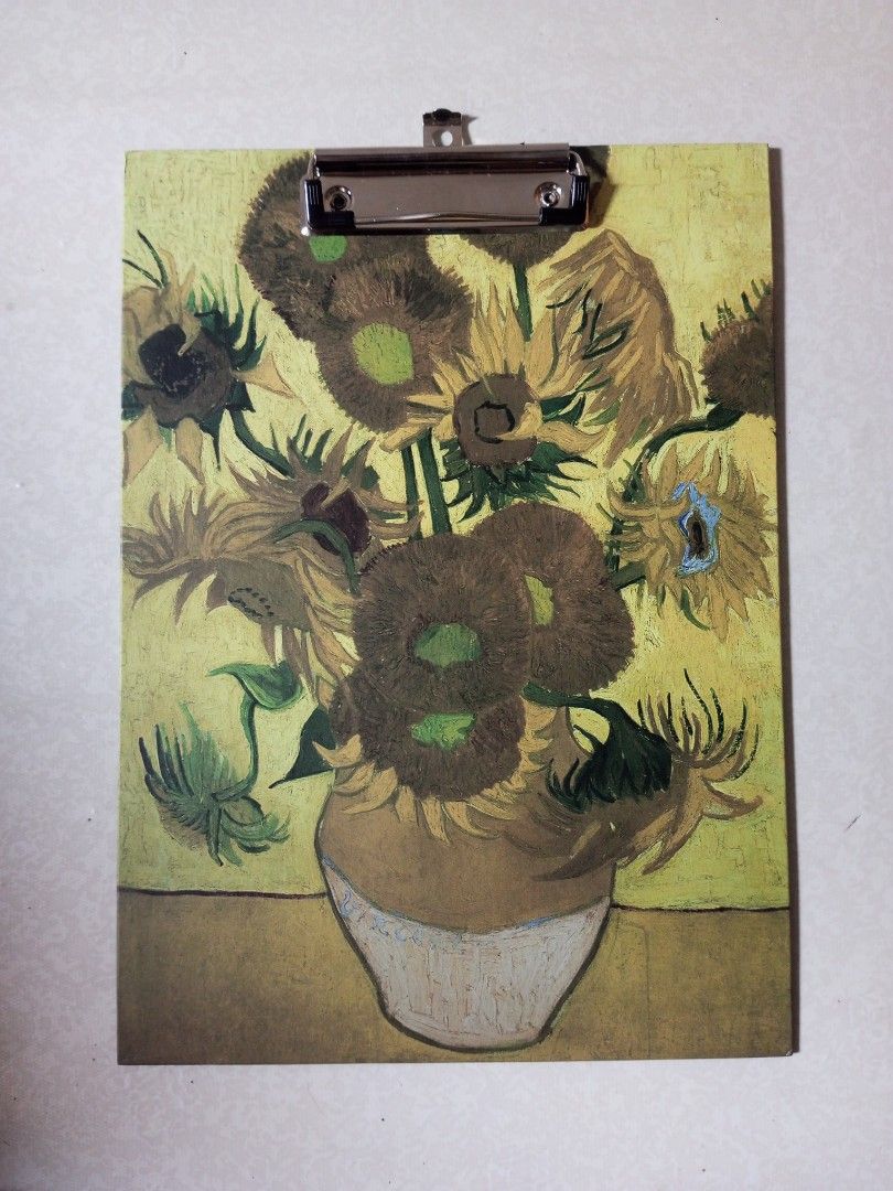 Van Gogh Sunflowers Art Clipboard (Category: Stationery & School Supplies) located in Malolos. Submitted by radapostol (Listing ID 1460160902, Image 1). Description: - Features Van Gogh's iconic Sunflowers painting. - Sturdy clip at the top for secure holding. - Ideal for artists, students, and art enthusiasts. - Perfect for organizing papers or showcasing artwork. - Adds a vibrant splash of color to your workspace..