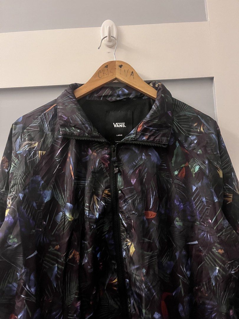 Vans Jacket Large Tropical Print Windbreaker (Category: Coats, Jackets and Outerwear) located in Calasiao. Submitted by cristinabarongan5 (Listing ID 1460190209, Image 2). Description: - Vans Jacket - Size: Large - Style: Windbreaker - Design: All-over tropical leaf print - Features: Full zip front, lightweight material - Perfect for: Casual wear, layering - Dimension 22 x 29 .