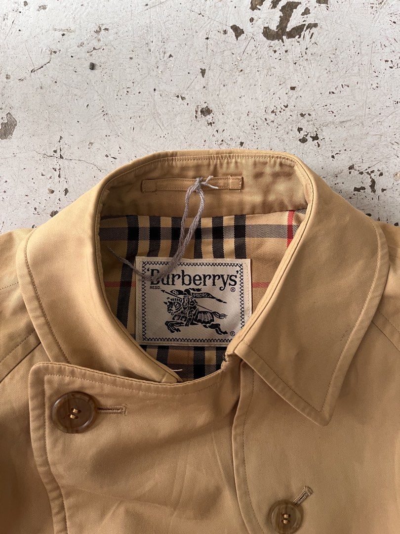 Vintage Burberry trench coat (Category: Luxury Apparel) located in Iloilo. Submitted by ukayhunter.ilo (Listing ID 1460207560, Image 3). Description: Vintage Burberry trench coat Flaws (1 pinhole back part check photos).