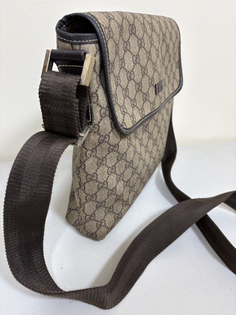 Vintage guccing cross body/shoulder (Category: Luxury Bags & Wallets) located in Los Banos. Submitted by ditasbautista2329 (Listing ID 1460300627, Image 2). Description: Preloved but well-loved guccing vintage style crossbody and shouder bag, crafted the bag with signature GG supreme coated leather trims, adjustable crossbody strap,, magnetic snap flap closure Actual pictures posted.