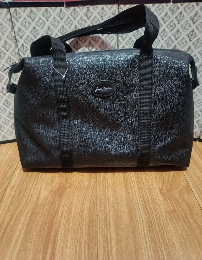 Vintage Jack Nicklaus Pebbled Duffel Bag (Black) (Category: Shoulder Bags) located in Makati City. Submitted by nyxhemera26 (Listing ID 1460158284, Image 1). Description: Vintage Jack Nicklaus Pebbled Duffel Bag (Black) Classic Jack Nicklaus weekend travel bag featuring a sleek black pebbled faux-leather exterior and the iconic cursive signature logo. Priced low for a fast, hassle-free sale. Excellent value for a roomy gym, golf, or airline carry