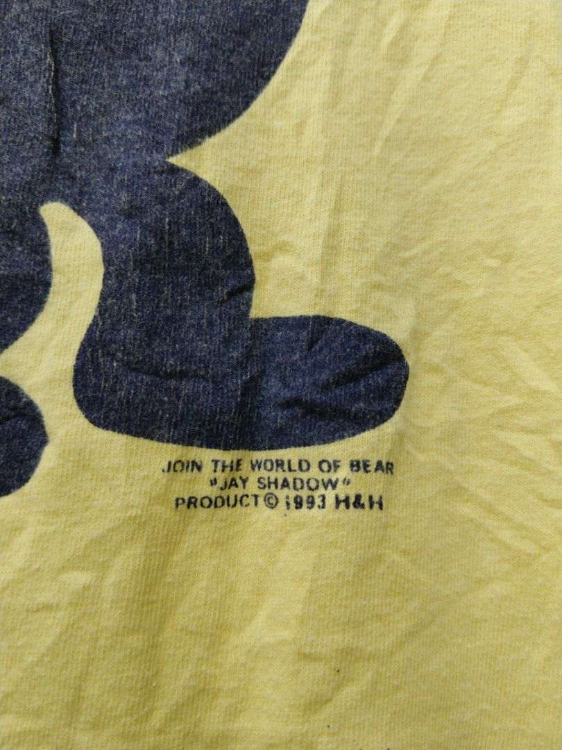 Vintage jay shadow bear (Category: Tshirts & Polo Shirts ) located in Legazpi City. Submitted by genobecollectives (Listing ID 1460157564, Image 2). Description: - Vintage yellow t-shirt - Navy blue bear graphic with 'Jay Shadow' text - Size L (fits 14-16) - 100% Cotton, Made in USA (ONEITA POWER-T tag) - Small mark on front near collar 500 free ship 20 x 24.