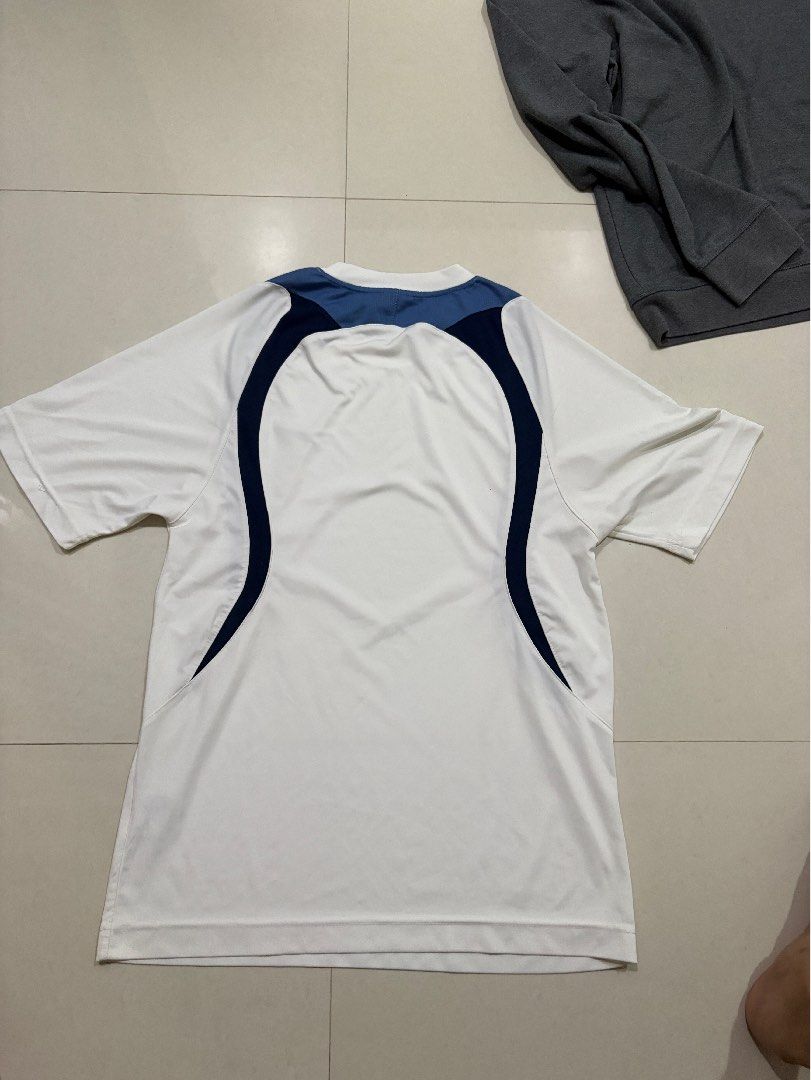 Vintage nike dri fit (Category: Tshirts & Polo Shirts ) located in Marilao. Submitted by astroman.22 (Listing ID 1460263941, Image 2). Description: - Classic white Nike t-shirt - Blue accents on shoulders and sides - Short sleeves - Breathable fabric, ideal for sports or casual wear - Simple and classic Nike design - Please check photos for detailed condition.