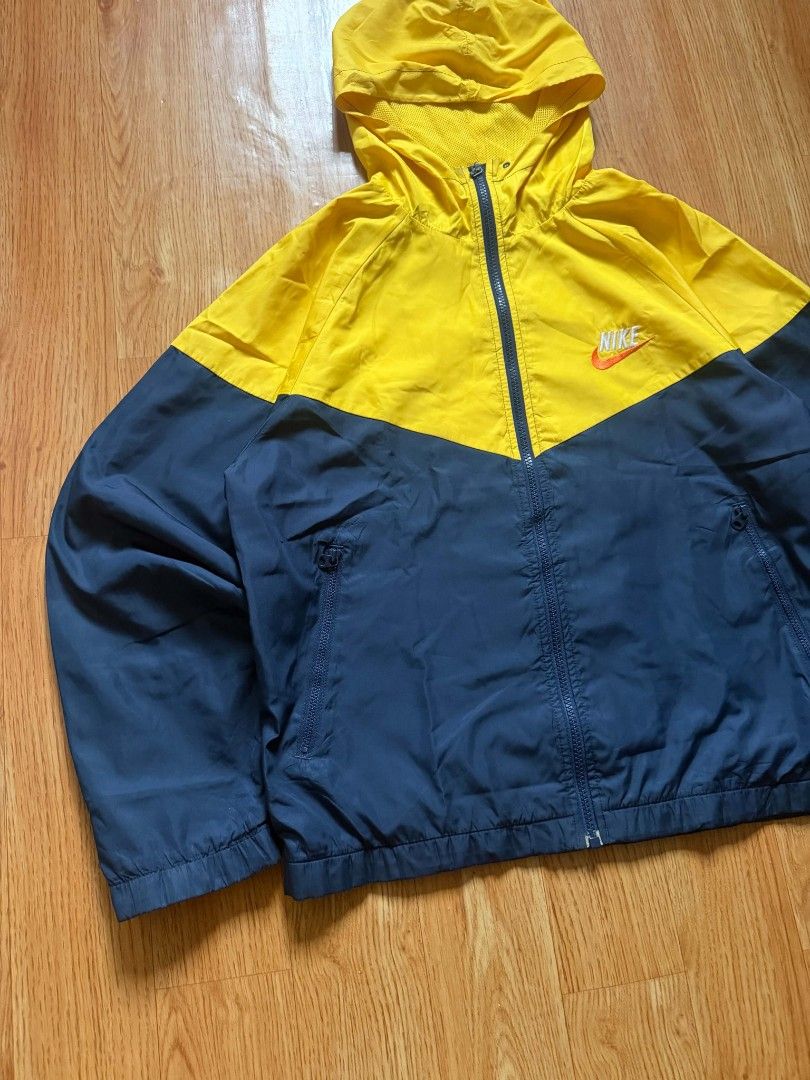 Vintage Nike Two Tone Windbreaker Jacket (Category: Coats, Jackets and Outerwear) located in Angeles City. Submitted by repurposedwear (Listing ID 1460201167, Image 3). Description: Nike windbreaker jacket (yellow/navy blue). Hooded, full zip, 2 zip pockets. Nike Fit Storm tech. Great for outdoors/casual. Issues : zipper pulley missing, zipper still works just a little bit difficult to unzip. clean colorway, must have 🔥🔥 size too small for me �