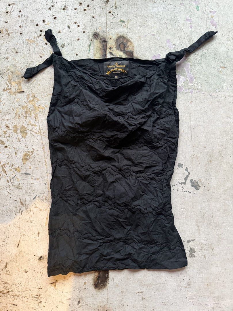Vivienne Westwood (Category: Sleeveless) located in Quezon City. Submitted by macleen17 (Listing ID 1460239770, Image 1). Description: Vivienne Westwood Excellent Condition Size 38 Black color Embroidery design .