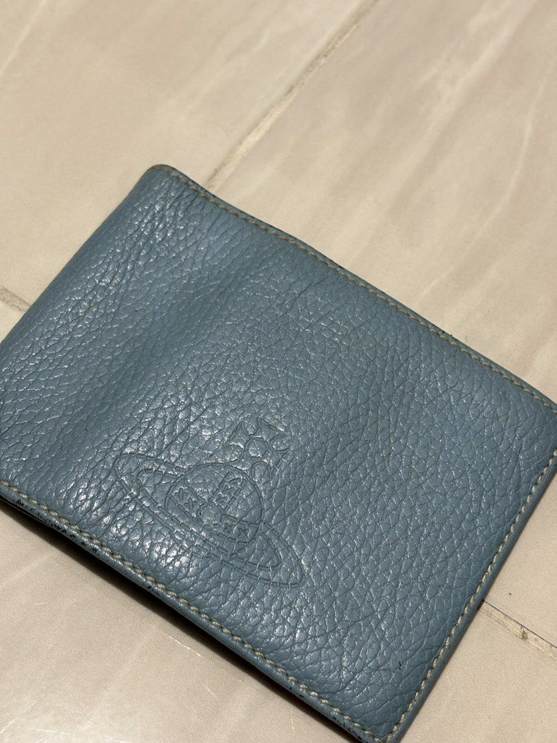 VIVIENNE WESTWOOD BIFOLD WALLET (Category: Luxury Bags & Wallets) located in Naga. Submitted by sislovesme (Listing ID 1460209450, Image 2). Description: •9/10 CONDITION •SIGN OF WEAR, SCRATCHES BUT STILL PRESENTABLE •ONE SIZE •MULTIPLE COMPARTMENT.
