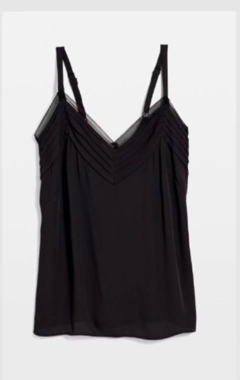 V-Neck Cami with Pleated Mesh Detail (Category: Sleeveless) located in Navotas City. Submitted by ms.soulana (Listing ID 1460154574, Image 2). Description: PreOwned LikeNew lightly Used Womens Vneck Cami Sleek black camisole top - Flattering V-neckline with delicate pleats - Subtle sheer mesh trim - Spaghetti straps for custom fit - Versatile for layering or wearing alone Good Condition 9/10 .