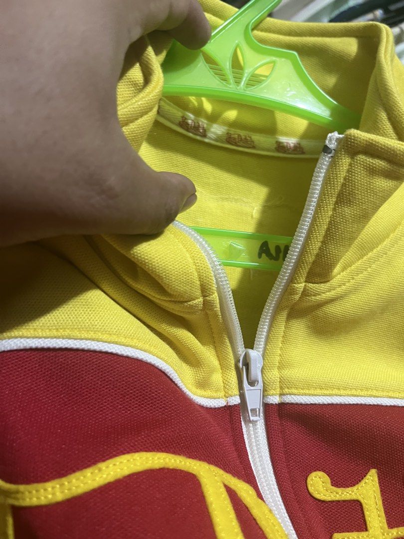 Von Dutch Track Jacket Red Yellow Size Small (Category: Coats, Jackets and Outerwear) located in Tabuk. Submitted by collectors_thrift_shop (Listing ID 1460120019, Image 3). Description: - Classic red and yellow Von Dutch track jacket - Features iconic Von Dutch logo across the chest - Zipper closure with convenient side pockets - Size: Small - Proudly American made.