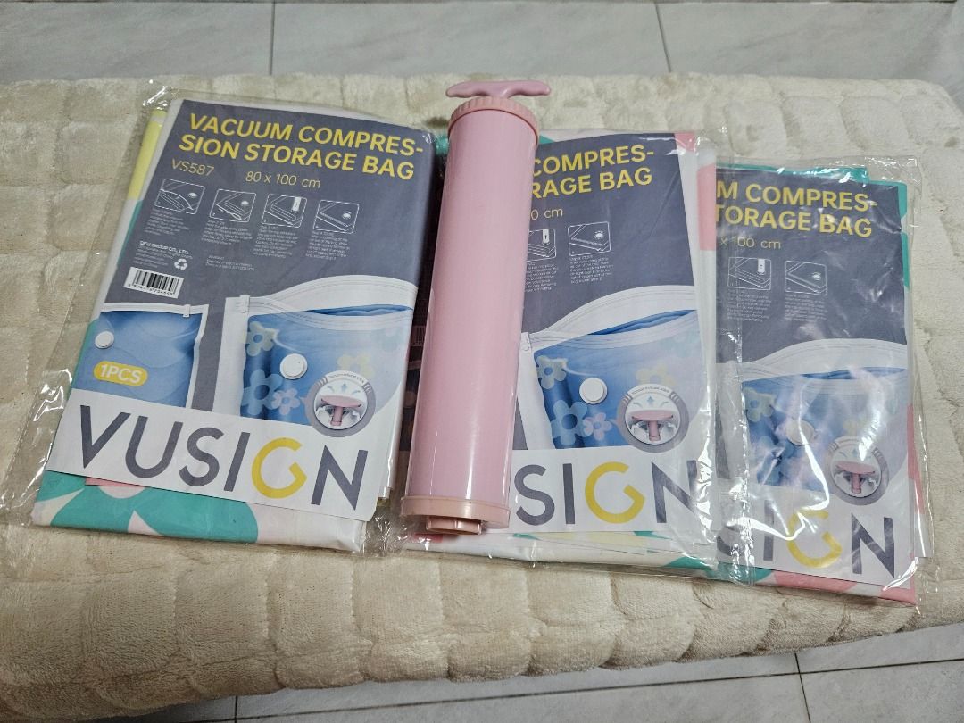 VUSION Vacuum Compression Storage Bags with Pump (Category: Storage Boxes & Baskets) located in Tanza. Submitted by mama_1996sagi (Listing ID 1460229402, Image 1). Description: - VUSION Vacuum Compression Storage Bags Set size 80x100cm - Includes Pink Hand Pump - Perfect for saving space on clothes and bedding - Easy to use for home organization and decluttering.
