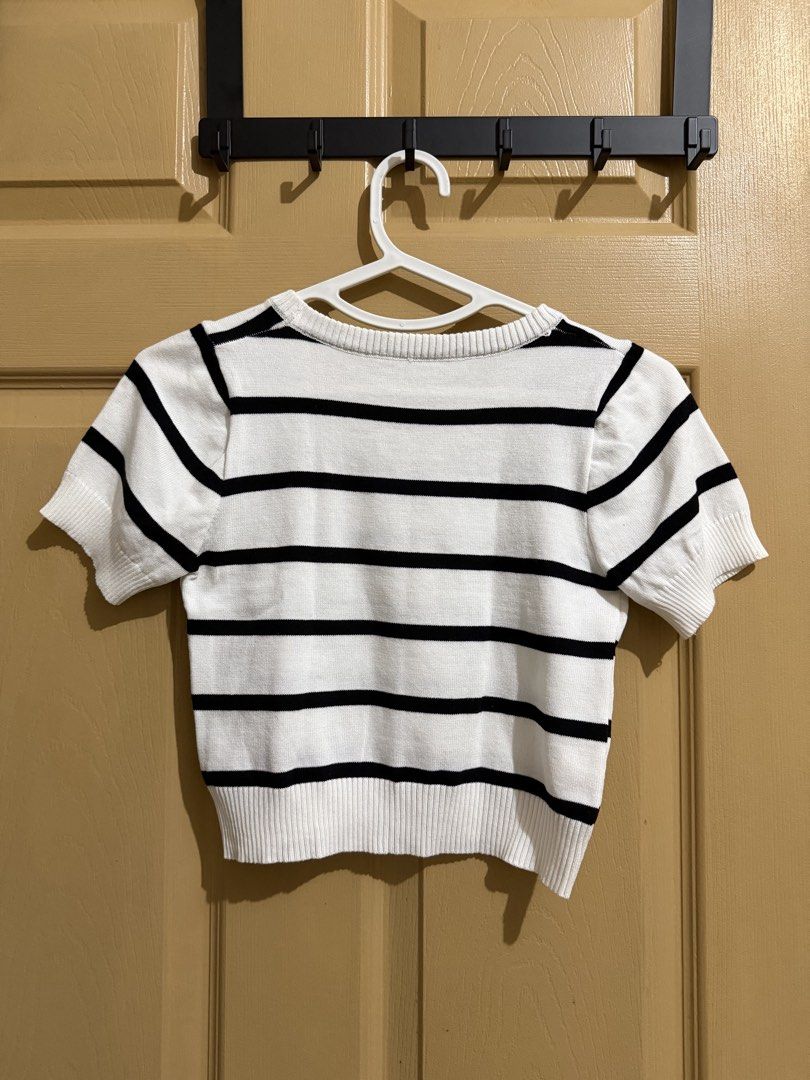 White and Black Striped Cropped Knit Top (Category: Blouses) located in Manila. Submitted by chavirly (Listing ID 1460190196, Image 2). Description: - Cute cropped knit top - White with black horizontal stripes - Short sleeves - Crew neckline - Ribbed hem and cuffs - Perfect with high-waisted bottoms - Easy to style for casual or dressed-up looks.