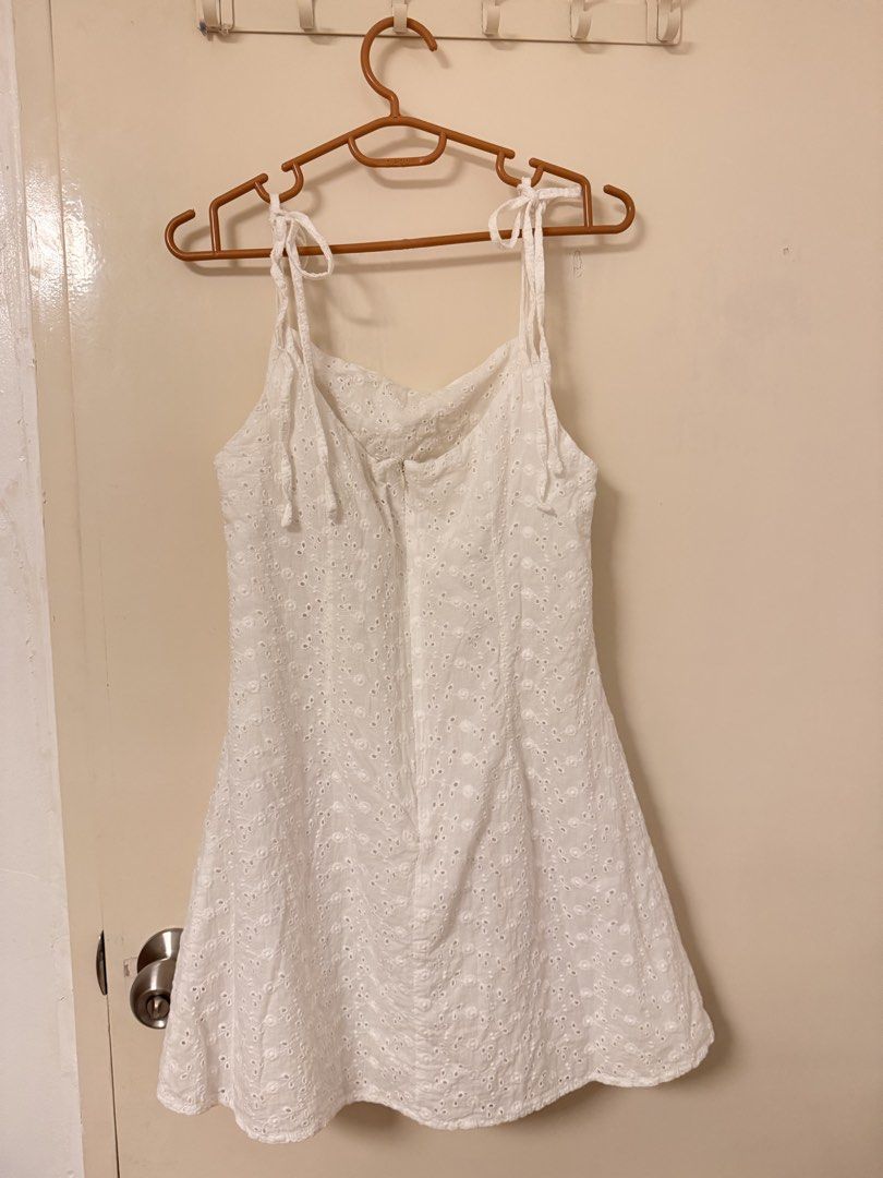 White Eyelet Mini Sundress with Self-Tie Straps (Category: Dresses) located in Bacoor. Submitted by ailujanitsirc (Listing ID 1460258795, Image 2). Description: ✧･ﾟ: *✧･ﾟ:* - Cute white eyelet mini sundress - Adjustable tie straps - Zipper closure at the back - Small stain on front near hem (refer to last photo for details) - Bought at STP Flea Market for ₱750 - RFS: Decluttering MOP: Gcash, BPI, and Maya Delivery: Lalamove, Grab Express, Gogo ex