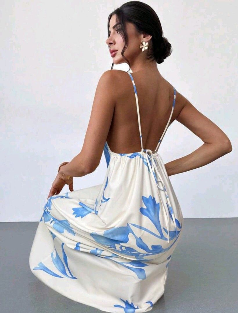 White Floral Maxi Dress with Backless Design (Category: Dresses) located in Manila. Submitted by pinkyrare (Listing ID 1460167773, Image 1). Description: - Flowy white maxi dress - Beautiful blue floral print - Thin spaghetti straps - Daring backless design - Adjustable tie at the back for a comfortable fit - Ideal for summer events or beach vacation - Lightweight and airy fabric.