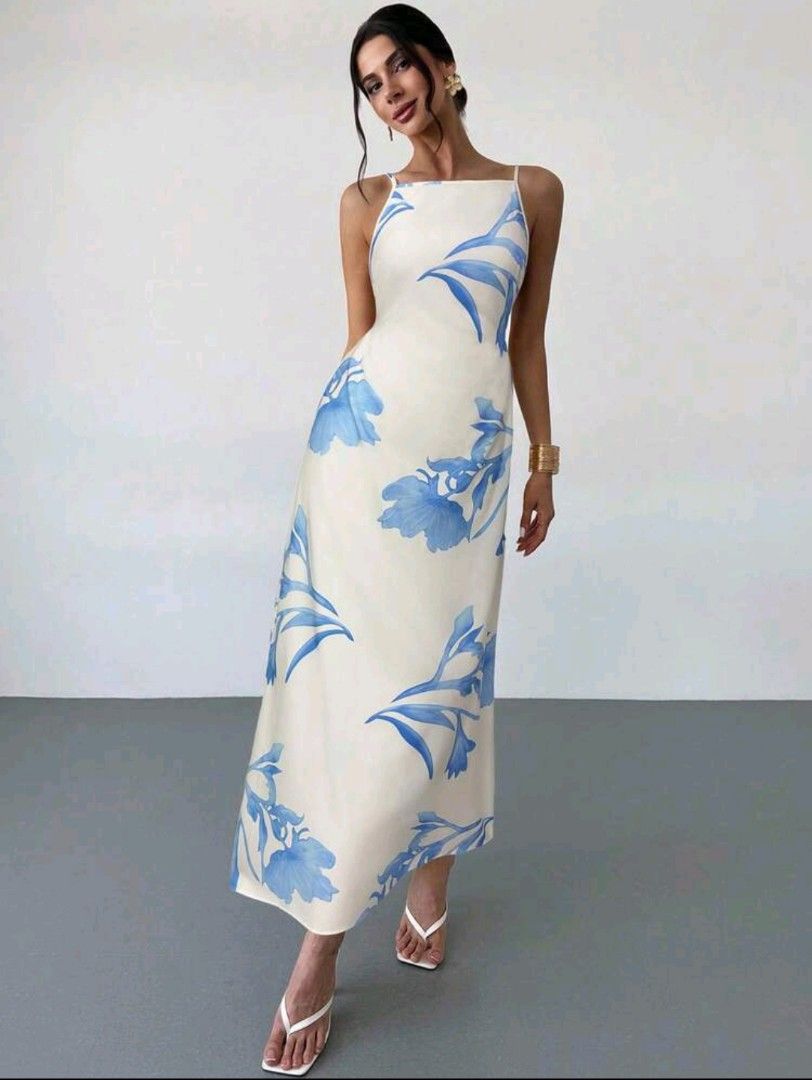 White Floral Maxi Dress with Backless Design (Category: Dresses) located in Manila. Submitted by pinkyrare (Listing ID 1460167773, Image 3). Description: - Flowy white maxi dress - Beautiful blue floral print - Thin spaghetti straps - Daring backless design - Adjustable tie at the back for a comfortable fit - Ideal for summer events or beach vacation - Lightweight and airy fabric.