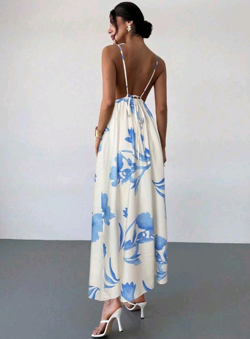 White Floral Maxi Dress with Backless Design (Category: Dresses) located in Manila. Submitted by pinkyrare (Listing ID 1460167773, Image 2). Description: - Flowy white maxi dress - Beautiful blue floral print - Thin spaghetti straps - Daring backless design - Adjustable tie at the back for a comfortable fit - Ideal for summer events or beach vacation - Lightweight and airy fabric.