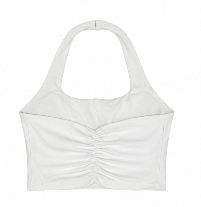 White Halter Workout Crop Top Ruched Back (Category: Sleeveless) located in Manila. Submitted by mika_declutter (Listing ID 1460269345, Image 2). Description: - Basic white halter neck crop top - Features ruched detail at the back - Made with stretchy material for comfort - With pad slots.