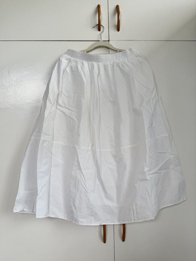 White Midi Skirt with Pockets (Category: Skirts) located in Paranaque City. Submitted by marjdom23__ (Listing ID 1460154395, Image 1). Description: • Worn a few times • Has a minor but unnoticeable stain • Can fit M-L • RFS: Decluttering.