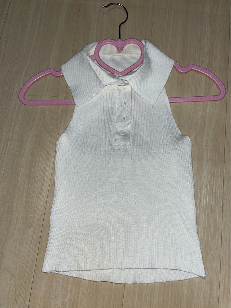 White Ribbed Collared Sleeveless Tank Top (Category: Sleeveless) located in Santa Rosa. Submitted by angee18 (Listing ID 1460191010, Image 1). Description: - White ribbed tank top - Features a collar and button details - Sleeveless design - Stretchy and comfortable fabric - Versatile for layering or wearing on its own - Pairs well with jeans or skirts - Easy to style for casual or dressed-up occasions - Fits XS - SMALL - Need i-laundry stains due